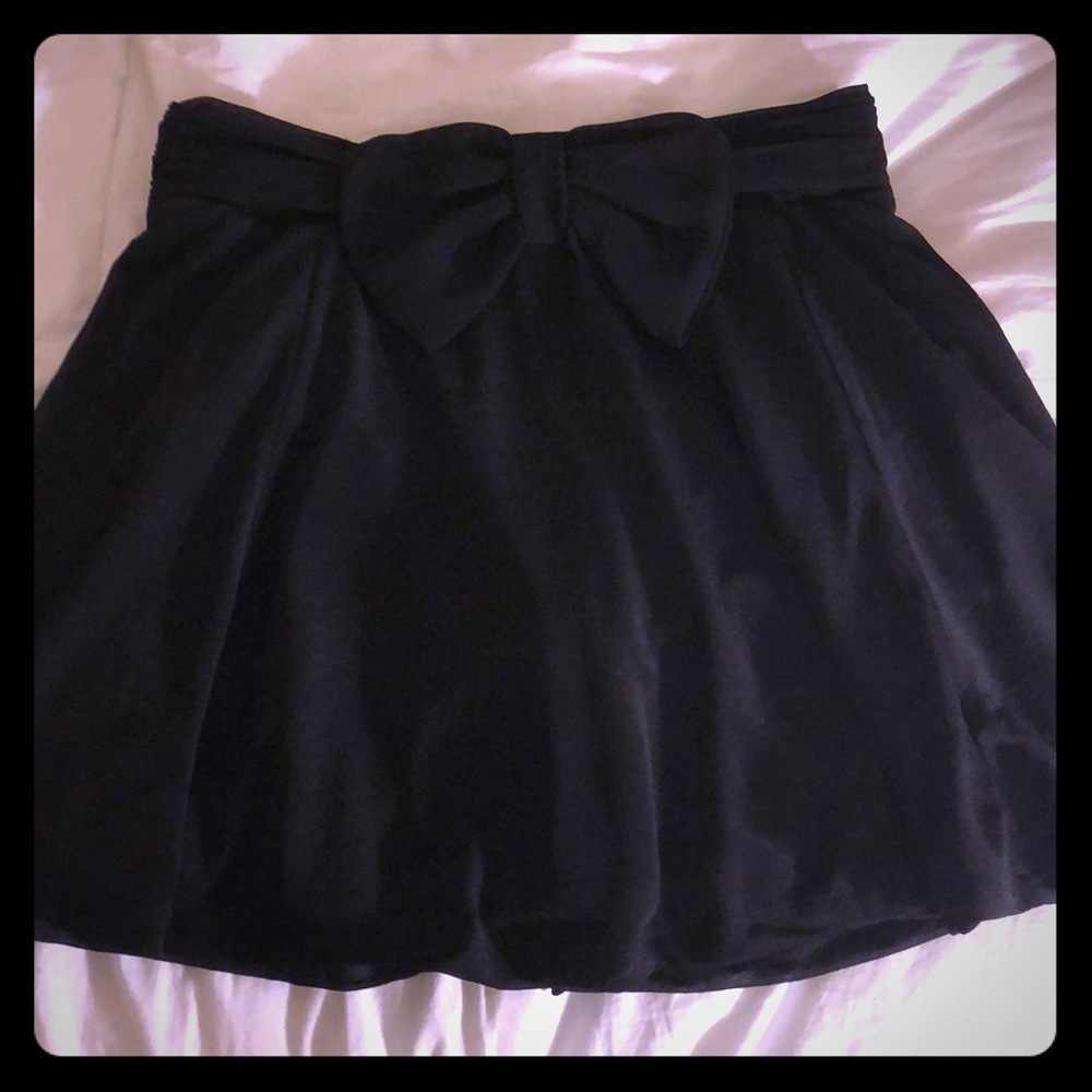 H&M mini black skirt with cute bow in the front!